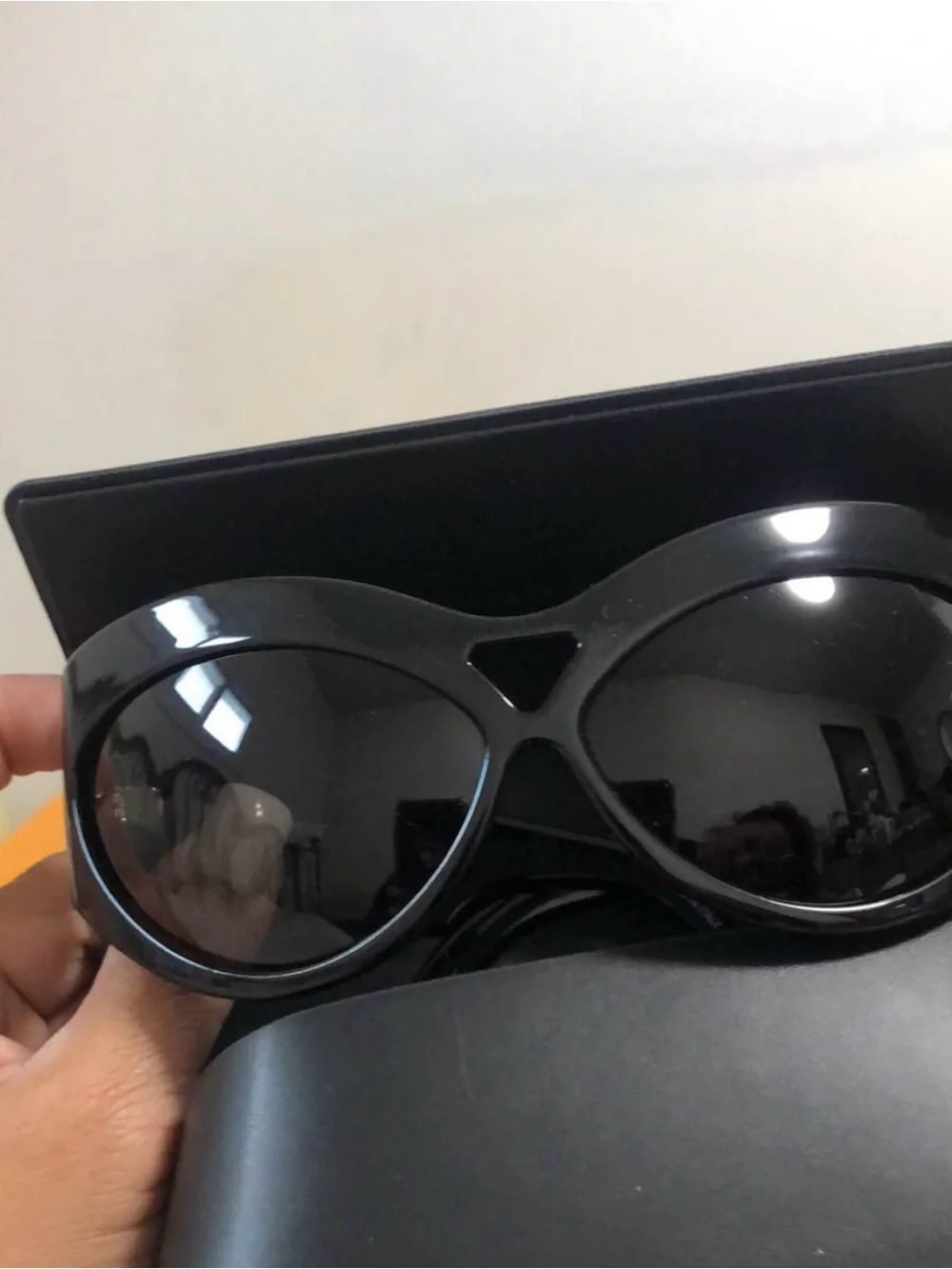 Yves Saint Laurent Black Women's Oval Sunglasses with Dark Lenses